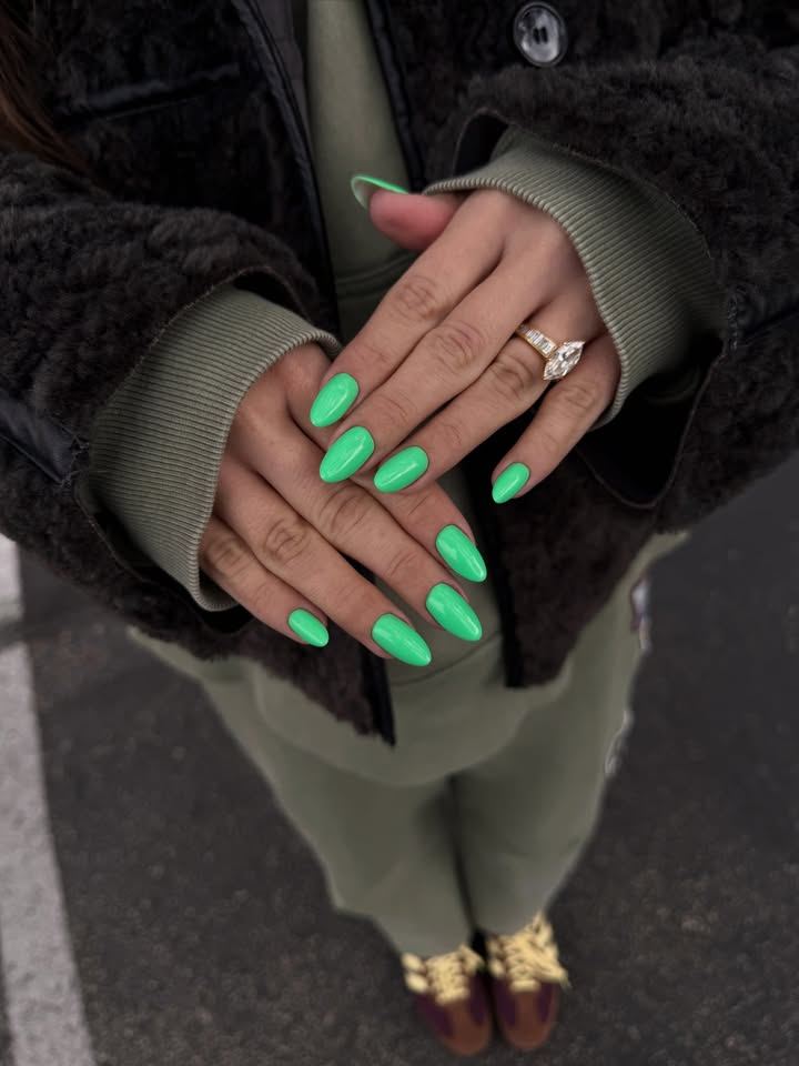 Bright green almond-shaped gel manicure